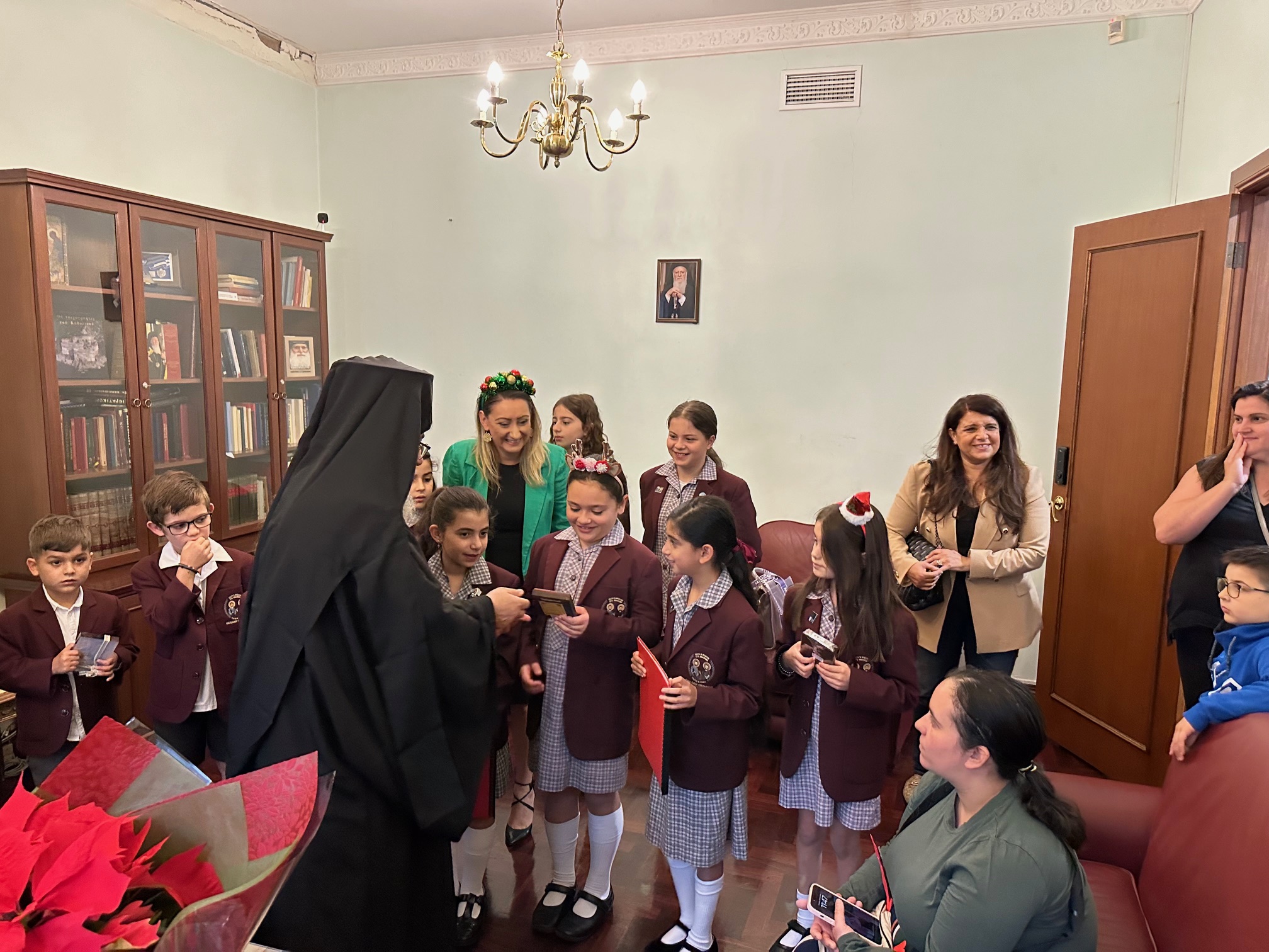 Students from Oakleigh Grammar sang traditional carols from Chios for Bishop Kyriakos of Sozopolis
